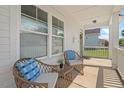 Cozy front porch with wicker seating and charming decor at 309 S Haywood St St, Raleigh, NC 27601