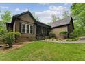 Beautifully maintained home with lush lawn and mature landscaping for enhanced curb appeal at 31 River View Ct, Timberlake, NC 27583
