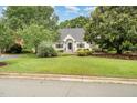 Charming one story brick home with a landscaped yard and front lawn at 600 Driftwood Dr, Gibsonville, NC 27249