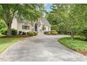 Charming one story brick home with a landscaped yard and driveway at 600 Driftwood Dr, Gibsonville, NC 27249
