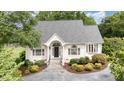 Charming one story brick home with a landscaped yard and driveway at 600 Driftwood Dr, Gibsonville, NC 27249
