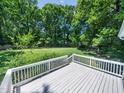Expansive backyard with lush greenery, viewed from a well-maintained deck, perfect for outdoor enjoyment at 7605 Copper Mine Ln, Raleigh, NC 27615