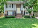 Home exterior featuring a brick staircase leading to a front door at 7605 Copper Mine Ln, Raleigh, NC 27615
