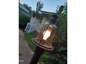 Outdoor shot showcasing a lantern-style yard light on a wooden post, adding ambiance to the home at 912 Dixie Trl, Raleigh, NC 27607