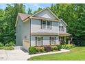 Two-story home with attached garage and attractive landscaping at 110 Lexington Ave, Zebulon, NC 27597
