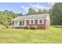 Well-kept brick house with a green lawn and inviting curb appeal at 1105 Horseshoe Rd, Durham, NC 27703