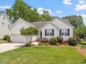 Charming single-story home with manicured lawn and inviting curb appeal at 1662 Beechaven Rd, Fuquay Varina, NC 27526