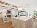 Spacious gourmet kitchen with marble island, custom cabinets, and an open concept living space at 2120 Kipawa St, Raleigh, NC 27607