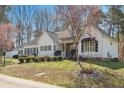 Desirable home with blooming trees, established landscaping, and a traditional design at 2420 Mollynick Ln, Wake Forest, NC 27587
