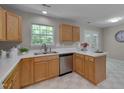 Kitchen view showcasing stainless steel appliances, wood cabinets, and ample counter space at 314 Virens Dr, Cary, NC 27511