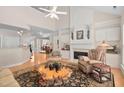 Bright living room featuring a fireplace, vaulted ceilings, and hardwood floors at 3619 Lion Ridge Ct, Raleigh, NC 27612