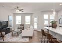 Inviting living room with abundant natural light, comfortable seating, and easy access to the kitchen area at 3924 Well Fleet Dr, Fuquay Varina, NC 27526