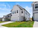 Bright and sunny two-story home with lush green lawn and a two car garage at 5113 Ranger Grove Way, Raleigh, NC 27604