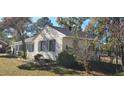 Side view of a home with blue shutters and a manicured yard at 526 N Fairview Rd, Rocky Mount, NC 27801