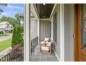 Relaxing front porch with comfortable seating and stylish railings at 5308 Montclair Dr, Raleigh, NC 27609