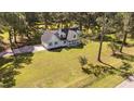 Aerial view of a beautiful home on a large lot surrounded by mature trees at 620 Richardson Rd, Zebulon, NC 27597
