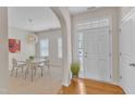 Welcoming foyer with hardwood floors leading into a bright dining area and adjacent rooms at 711 Keystone Park Dr # 7, Morrisville, NC 27560