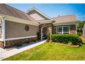 Charming house featuring shake siding, stone accents, manicured lawn, and covered entrance at 740 Blackfriars Loop, Cary, NC 27519