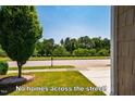 This property has no homes across the street with a beautiful wooded and scenic view at 740 Blackfriars Loop, Cary, NC 27519