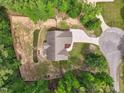 A bird's eye view of the home shows off its sprawling backyard with a charming patio at 105 Old Barn Way, Wendell, NC 27591
