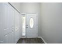 Bright entryway with closet and decorative oval glass door at 1110 Elmira Ave, Durham, NC 27707