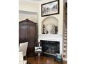 Inviting living room featuring a cozy fireplace and elegant decor at 12221 Orchardgrass Ln, Raleigh, NC 27614