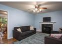Inviting living room with a cozy fireplace, comfortable seating, and stylish decor creating a warm atmosphere at 129 Clark Ct, Youngsville, NC 27596