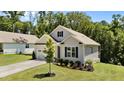Beautiful single-Gathering home with a well-maintained lawn, mature landscaping, and an attached two-car garage at 159 Clear Water Rd, Louisburg, NC 27549
