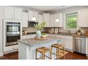 Modern kitchen with stainless steel appliances, granite countertops, and a center island with seating at 1600 Drift Falls Ln, Wendell, NC 27591