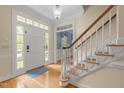 Inviting foyer features hardwood floors and a staircase to the second level at 18 Acornridge Ct, Durham, NC 27707