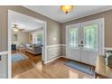 Bright foyer boasts hardwood floors and lovely double doors at 1920 Hillock Dr, Raleigh, NC 27612