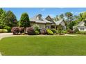 Lovely front yard with mature landscaping and a well-manicured lawn at 238 Michelangelo Way, Cary, NC 27518