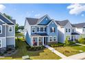 Well-maintained two-story home with manicured lawn, covered entry, and tidy landscaping at 279 Edge Of Auburn Blvd, Raleigh, NC 27610