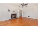 Inviting living room featuring a classic brick fireplace and hardwood floors at 408 N Stewart St, Clayton, NC 27520