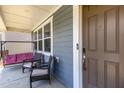 Inviting covered front porch features outdoor seating and a cozy porch swing at 425 Liberty Hill, Morrisville, NC 27560