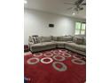 Cozy living room featuring a large sectional sofa with a circular patterned rug at 425 Liberty Hill, Morrisville, NC 27560