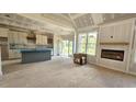 Open-concept design showcasing the living room, fireplace, and seamless transition to the kitchen area at 55 Livingston Ln, Spring Hope, NC 27882