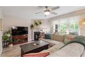 Cozy living room with fireplace and comfortable seating area at 6032 Epping Forest Dr, Raleigh, NC 27613