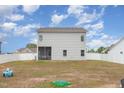 Large backyard featuring a white fence and grass that needs some love at 72 Ina Rose Ln, Four Oaks, NC 27524