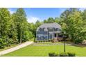 Beautiful two-story home featuring a well-manicured lawn and a classic design, perfect for Gathering living at 8304 Southmoor Hill Trl, Wake Forest, NC 27587