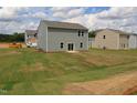 Expansive backyard featuring new sod and ample space for outdoor activities at 956 Bombardier Ln, Spring Hope, NC 27882