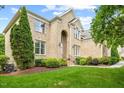 Stunning brick home with lush landscaping, showcasing architectural details and a well-maintained lawn at 9603 Clubvalley Way, Raleigh, NC 27617