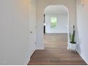 A view of the home's entryway with a door leading into a living space and a potted plant at 1056 Evening Shade Ave, Rolesville, NC 27571