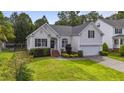 Charming home with manicured lawn, two-car garage, and landscaping at 107 Governors House Dr, Morrisville, NC 27560
