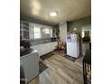 The home's kitchen includes an oven, sink, refrigerator, and hardwood flooring at 109 N 2Nd St, Sanford, NC 27330