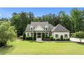 Beautiful two-story home with lush lawn and landscaped garden at 1412 Wakefield Farm Rd, Zebulon, NC 27597