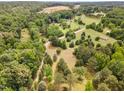 Beautiful aerial view showcasing the property's expansive land at 197 Country Routt Brown Rd, Pittsboro, NC 27312
