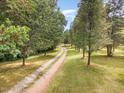 Long driveway leading to a secluded property at 197 Country Routt Brown Rd, Pittsboro, NC 27312