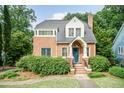 Beautiful brick home featuring a classic design, well-maintained landscaping, and inviting entrance at 2236 The Cir, Raleigh, NC 27608