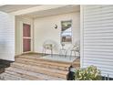 Cozy front porch with seating, providing a welcoming entrance to the home at 2616 Kirk Rd, Durham, NC 27705